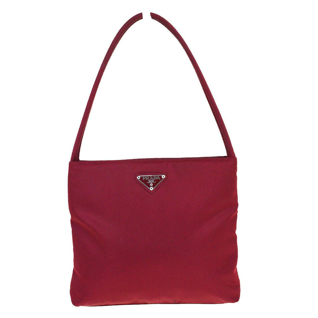 Authentic Prada Nylon Shoulder Bag: Brand: PRADA Style: Shoulder Bag Material: Nylon Color: Bordeaux Size: Medium Size (Inches): W 10.6 x H 7.9 x D 2.4 "(approx.) Strap Drop: 7.1 Country of Origin: - Comes With: All Bidhaus items come w