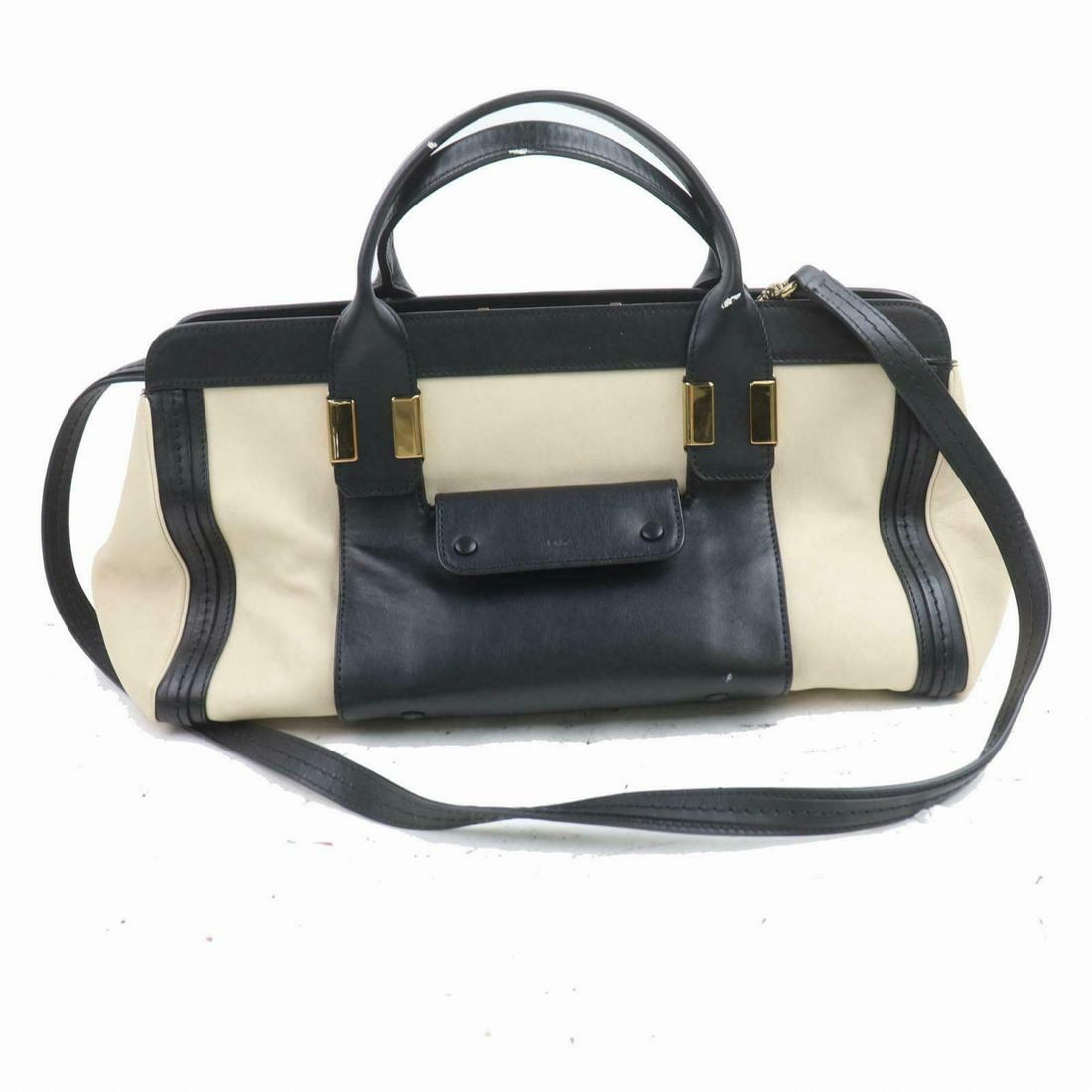 Authentic Chloe Leather Hand Bag: Brand: Chloe Style: Hand Bag Material: Leather Color: Black Height: 7.87 inch(approx) /20 cm(approx) Depth: 7.87 inch(approx) /20 cm(approx) Width: 14.5 inch(approx) /37 cm(approx) All Bidhaus items c