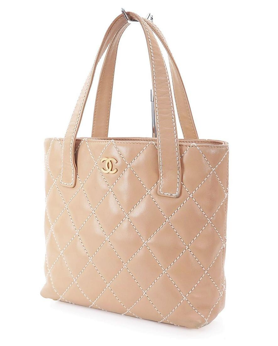 Authentic Chanel Leather Tote: Brand: CHANEL Style: Tote Material: Leather Color: Brown Comes With: Country of Origin: All Bidhaus items come with a 100% money-back authenticity guarantee. Please refer to images carefully for condi