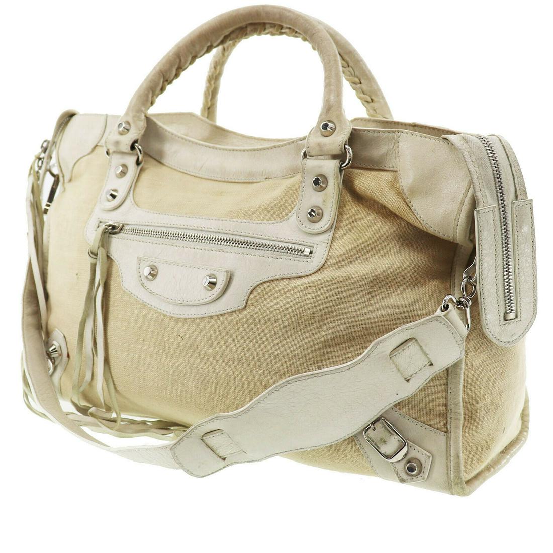 Authentic Balenciaga Ivory White Canvas Leather: Brand: Balenciaga Material: Canvas Leather Color: Ivory White Size: H 9.8 x D 5.1 x L 15.1,Handle: 14.1Shoulder: 24.4 Made In: Italy Comes with: All Bidhaus items come with a 100% money-back authentic
