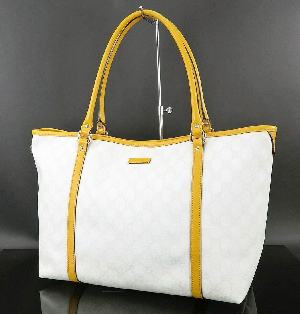 Authentic Gucci Canvas Tote: Brand: Gucci Style: Tote Material: Canvas Color: White Comes With: Nothing. Country of Origin: Italy All Bidhaus items come with a 100% money-back authenticity guarantee. Please refer to images carefu