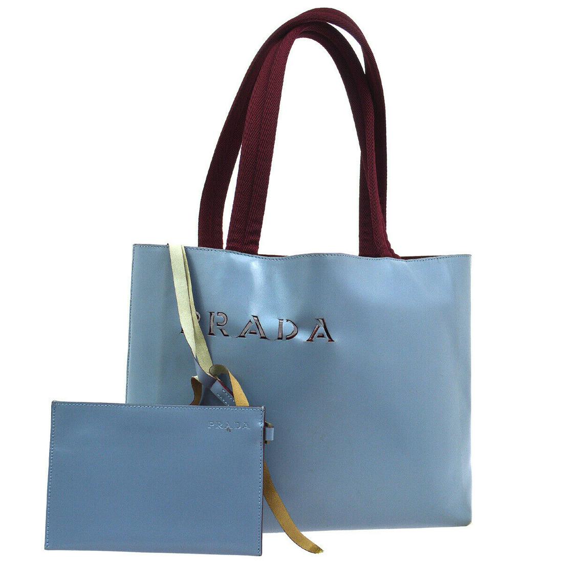 Authentic PRADA Leather, Nylon Tote: Brand: PRADA Material: Leather, Nylon Style: Tote Color: Light Blue, Bordeaux Size(inch): W10.8 x H9.4 x D3.3 " / Strap Drop: 7.9 Country of Origin: Italy