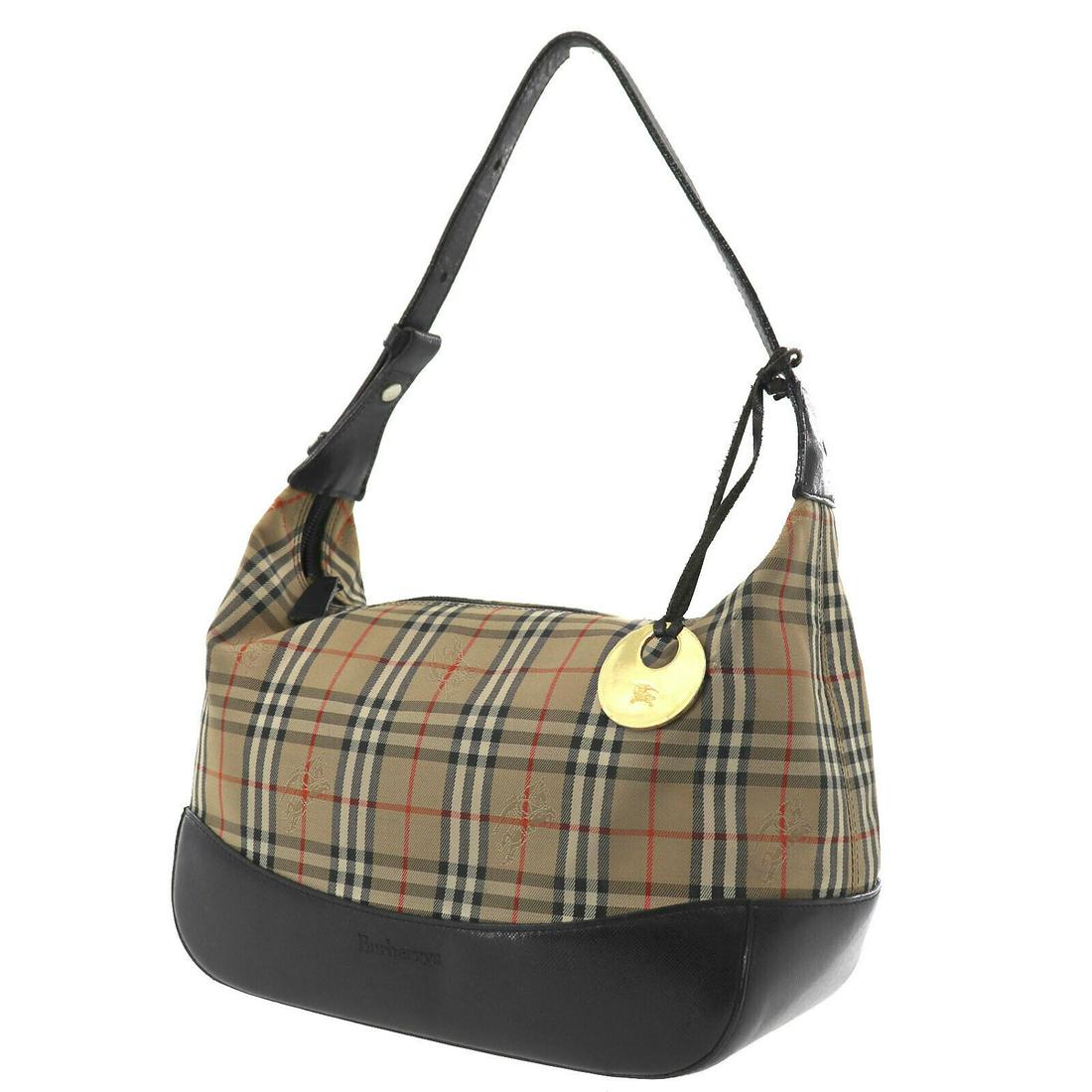 Authentic Beige Brown Burberry Hand Bag: Brand: Burberry Style: Hand Bag Color: Beige Brown Material: Canvas Leather Size (Inches): H 8.2 x D 4.3 x L 10.6Handle : 14.1 - 18.1 Comes With: - All Bidhaus items come with a 100% money-back authen