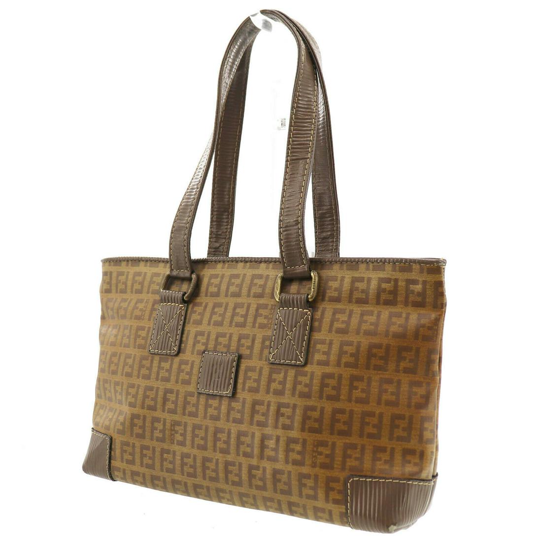 Authentic Brown Fendi Hand Bag: Brand: Fendi Style: Hand Bag Color: Brown Material: VinylÂ Leather Size (Inches): H 6.8 x D 2.7 x L 10.4Handle. 18.8 Comes With: - All Bidhaus items come with a 100% money-back authenticity guarante