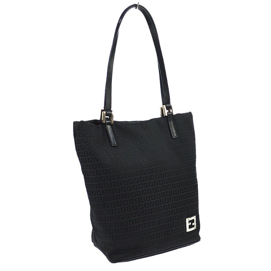 Authentic FENDI Canvas, Leather Hand Tote Bag: Brand: FENDI Material: Canvas, Leather Style: Hand Tote Bag Color: Black Size(inch): W7.1 x H9.4 x D4.3 " / Strap Drop: 7.9 Country of Origin: Italy