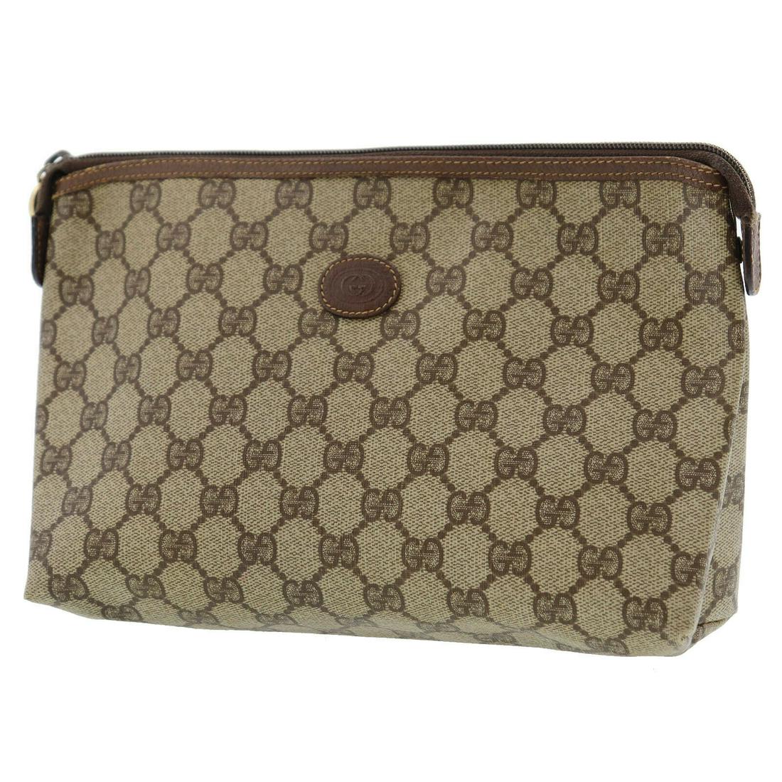 Authentic Brown Gucci Pouch: Brand: Gucci Style: Pouch Color: Brown Material: PVC Leather Size (Inches): H 6.2x D 2.9 x L 10.2 Comes With: - All Bidhaus items come with a 100% money-back authenticity guarantee. Please refer to im