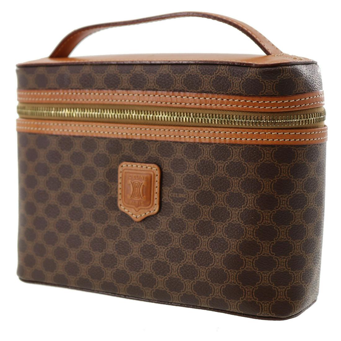 Authentic CELINE Macadam PVC Canvas Vanity Bag: Brand: CELINE Material: Macadam PVC Canvas Style: Vanity Bag Color: Brown Size(Inch): H 5.9 x D 2.7 x L 8.2 Handle. 7.4 Country of Origin: Italy All Bidhaus items come with a 100% money-back authentic