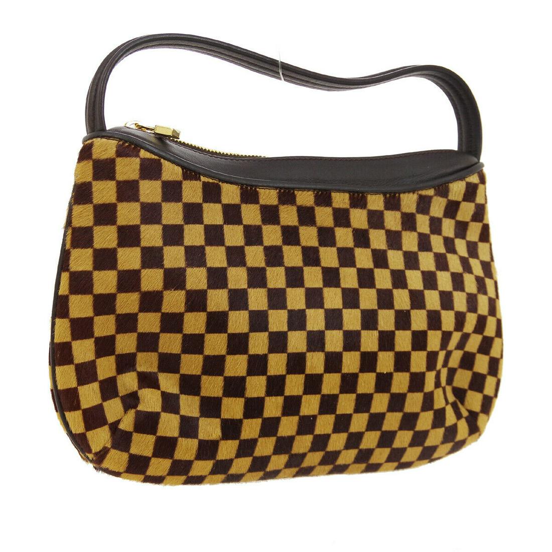 Authentic Louis Vuitton Fur, Leather Hand Bag: Brand: Louis Vuitton Material: Fur, Leather Style: Hand Bag Color: Brown Size(inch): W9.8 x H5.7 x D2.8 " / Strap Drop: 3.5 Country of Origin: Italy All Bidhaus items come with a 100% money-back authe