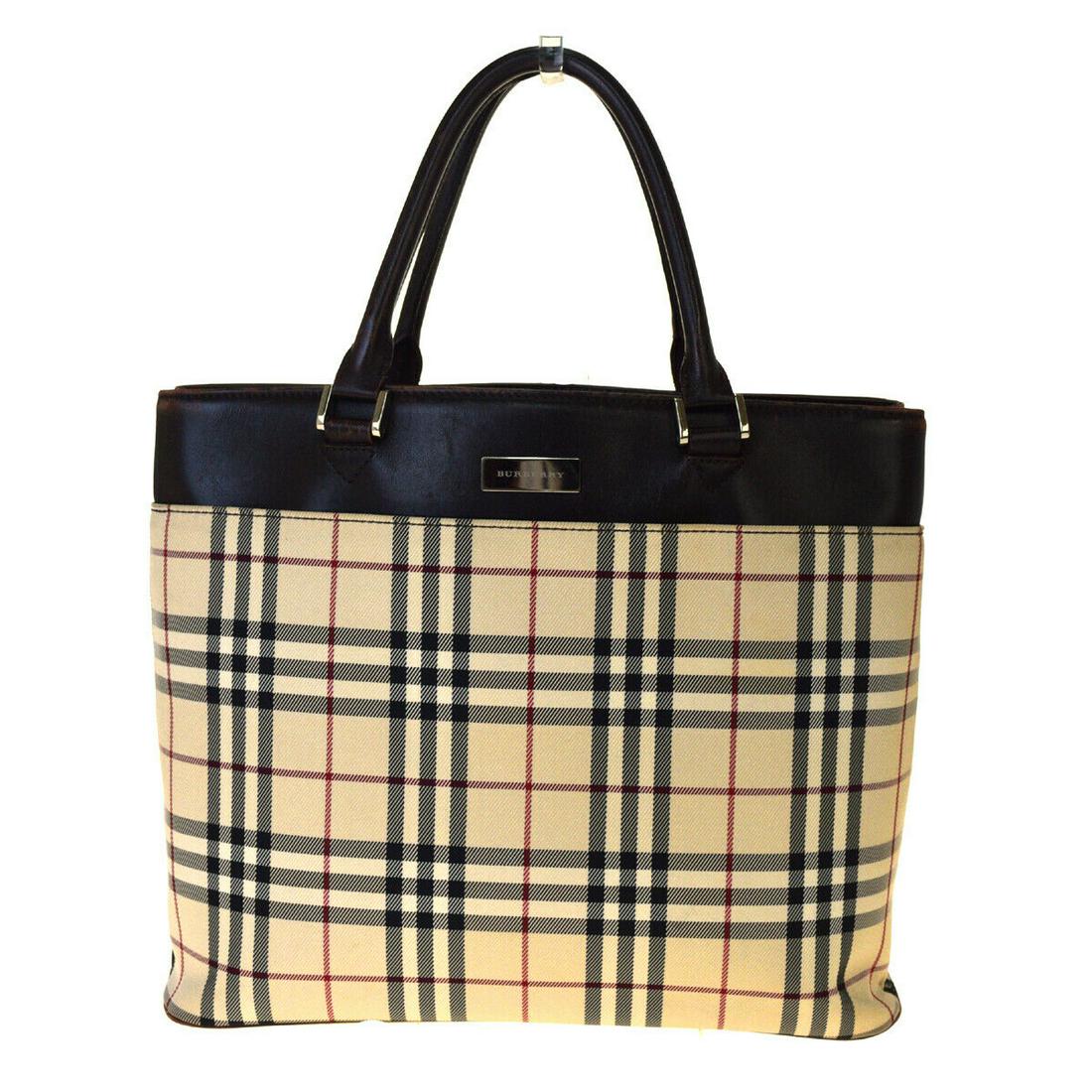 Authentic BURBERRY Blue Label Canvas Tote: Brand: Burberry Blue Label Material: Canvas Style: Tote bag Color: Beige Country of Origin: Unknown All Bidhaus items come with a 100% money-back authenticity guarantee. Please refer to images careful