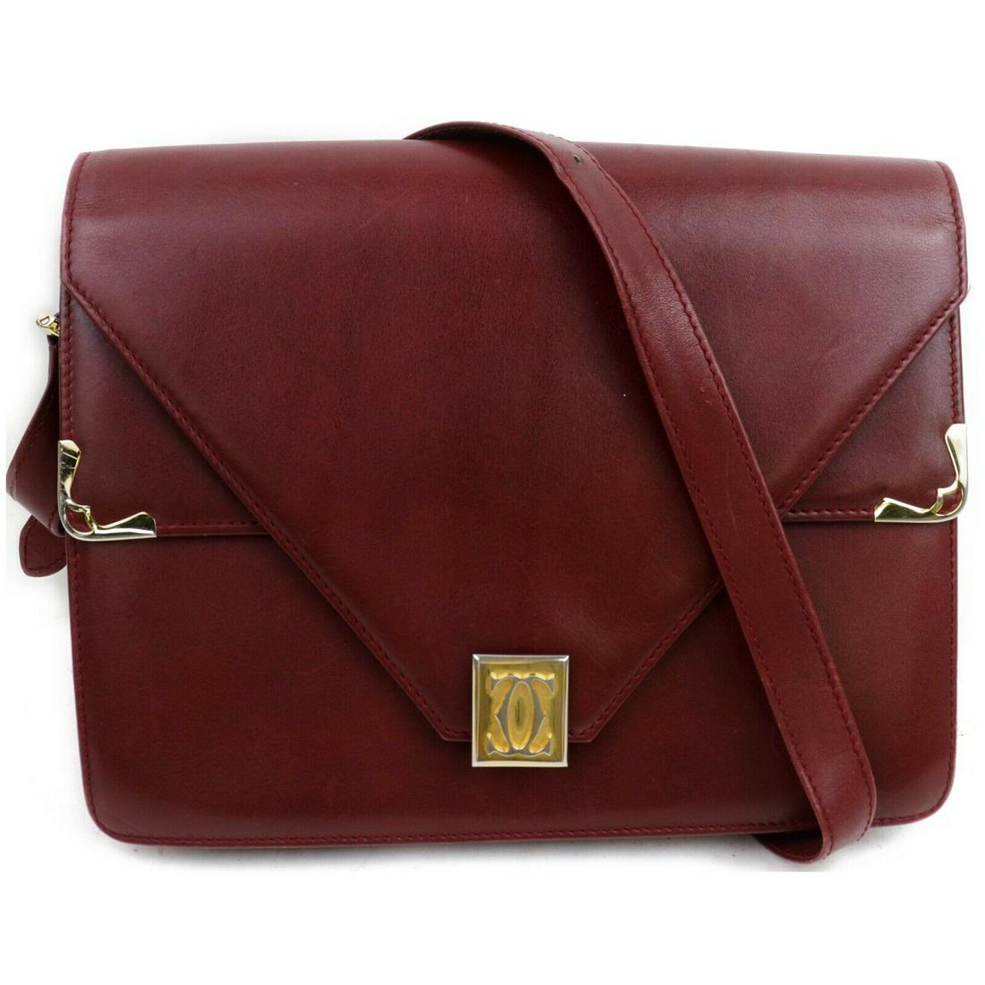 Authentic Cartier Leather Shoulder Bag: Brand: Cartier Material: Leather Style: Shoulder Bag Color: Bordeaux Size(inch): W9.44 inch(approx) /24 cm(approx) x H7.08 inch(approx) /18 cm(approx) x D1.57 inch(approx) /4 cm(approx) " / Strap Drop