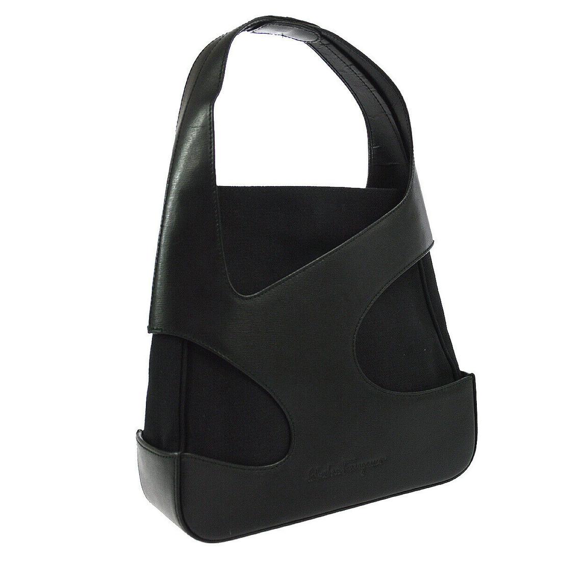 Authentic SALVATORE FERRAGAMO Logos Hand Bag: Brand: SALVATORE FERRAGAMO Material: Leather Style: Hand Bag Color: Black Size(inch): W9.1 x H8.3 x D2.8 " Country of Origin: Italy Come with: Dust Bag All Bidhaus items come with a 100% money-back au