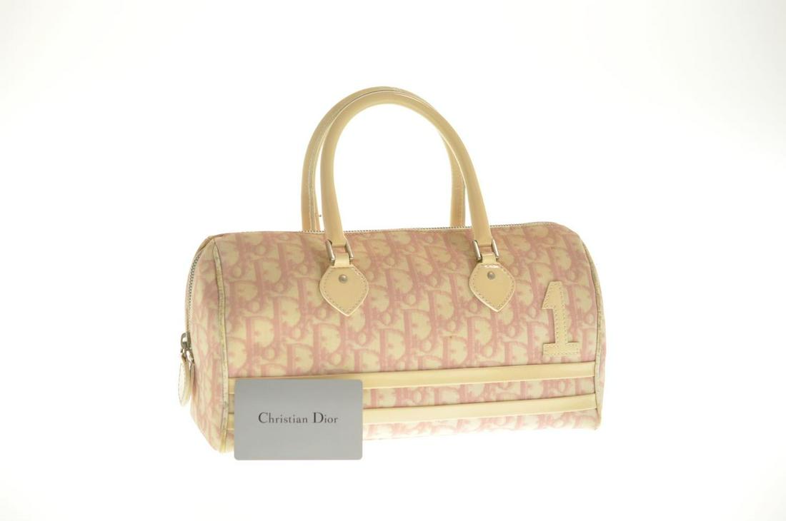 Authentic Christian Dior Trotter Canvas Hand Bag: Brand: Christian Dior Style: Hand Bag Material: Leather Color: Pink Size (Inches): W11.02 X H5.51 X D5.11Inch(Approx) Exterior Condition: Pvc Leather : Minor Loose Shape, Stain Piping : Rubbing, Signs
