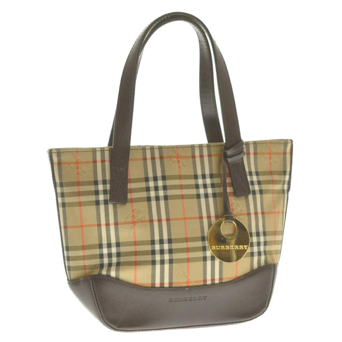 Authentic Burberry Nova Check Canvas Hand Bag: Brand: Burberry Style: Hand Bag Material: Nova Check Canvas Color: Beige Size (Inches): W5.9 X H6.69 X D3.14Inch(Approx) Exterior Condition: Nova Check Canvas : Loose Shape, Minor RubbingLeather : Par