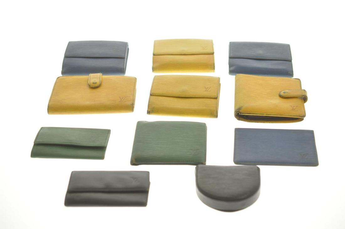 Authentic Louis Vuitton Epi Wallet Key Case 11Set: Brand: Louis Vuitton Style: Wallet / Key Case / Coin Case / Pass Case Material: Epi Leather Color: Yellow Blue Black Green Size (Inches): - Exterior Condition: Epi Leather : Wrinkle, Rubbing, Loose Sh