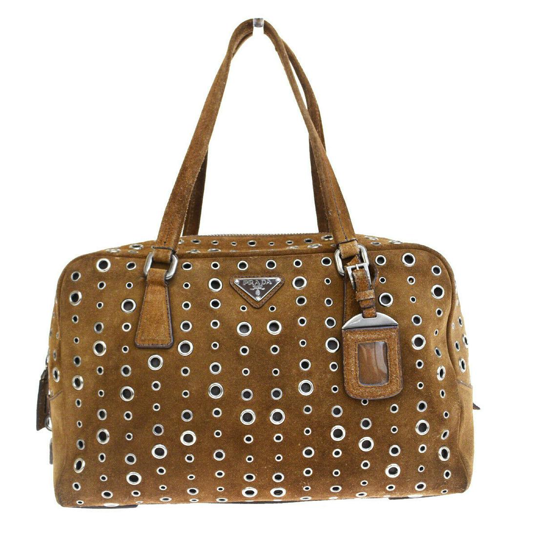 Authentic PRADA Suede Skin Leather Shoulder bag: Brand: PRADA Material: Suede Skin Leather Style: Shoulder bag Color: Brown Size(inch): W 12.6 x H 12.2 x D 5.5 "(approx.) Country of Origin: Italy Come with: Name tag,Key2,Keybell,Padlock All Bidhaus 