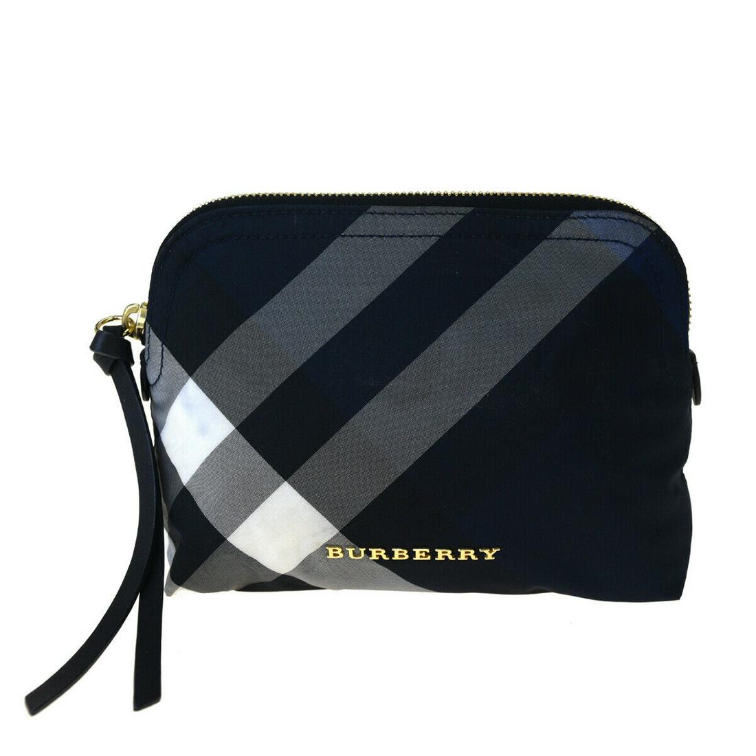 Authentic BURBERRY Nylon Pouch: Brand: BURBERRY Material: Nylon Style: Pouch Color: Navy Size (HxWxD): 14cm x 19cm x 5cm / 5.51'' x 7.48'' x 1.96'' Country of Origin: China All Bidhaus items come with a 100% money-back authenticity
