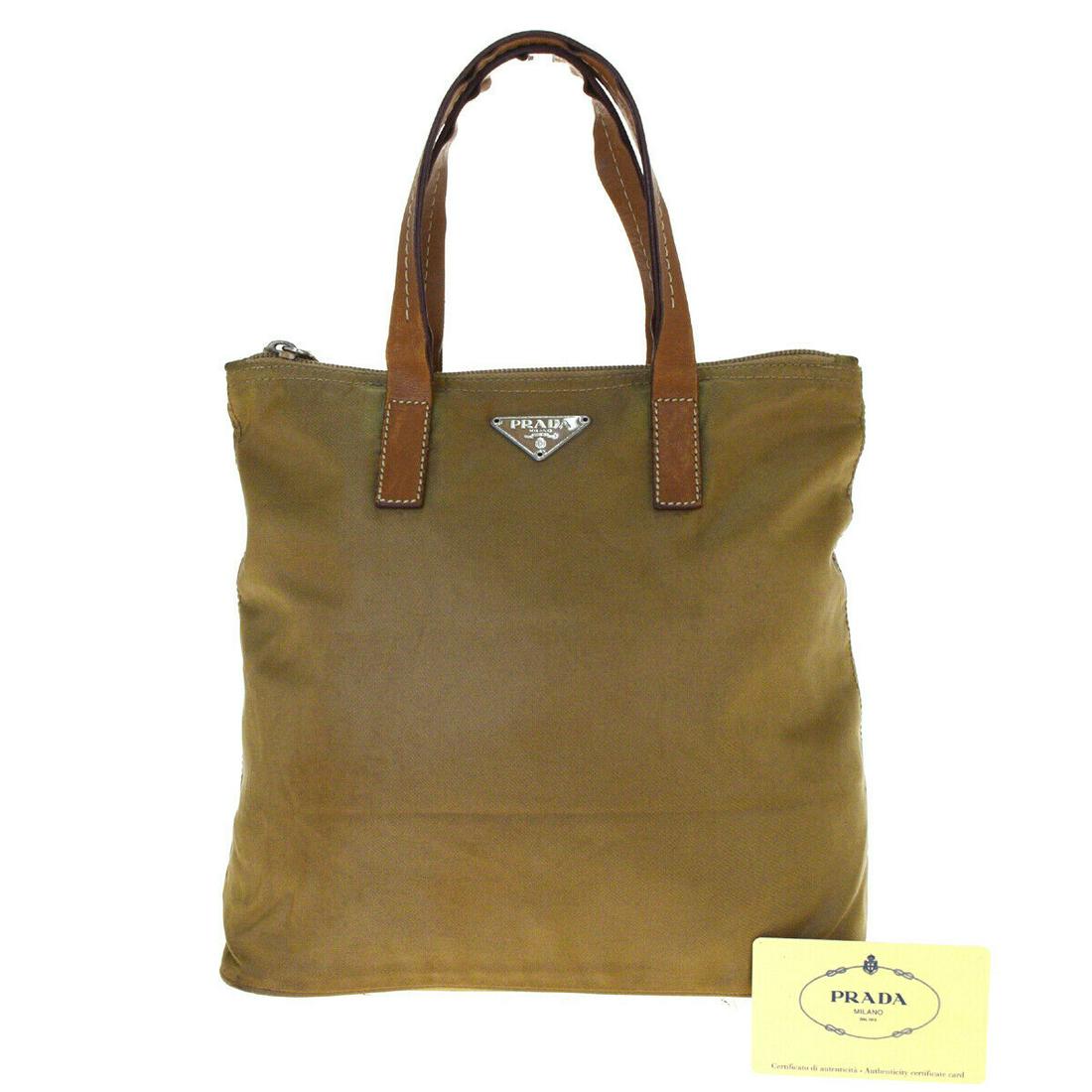Authentic PRADA Tote: Brand: PRADA Style: Tote bag Color: Brown Size (HxWxD): 22cm x 25cm x 13cm / 8.66'' x 9.84'' x 5.11'' Country of Origin: Italy All Bidhaus items come with a 100% money-back authenticity guarantee. Ple