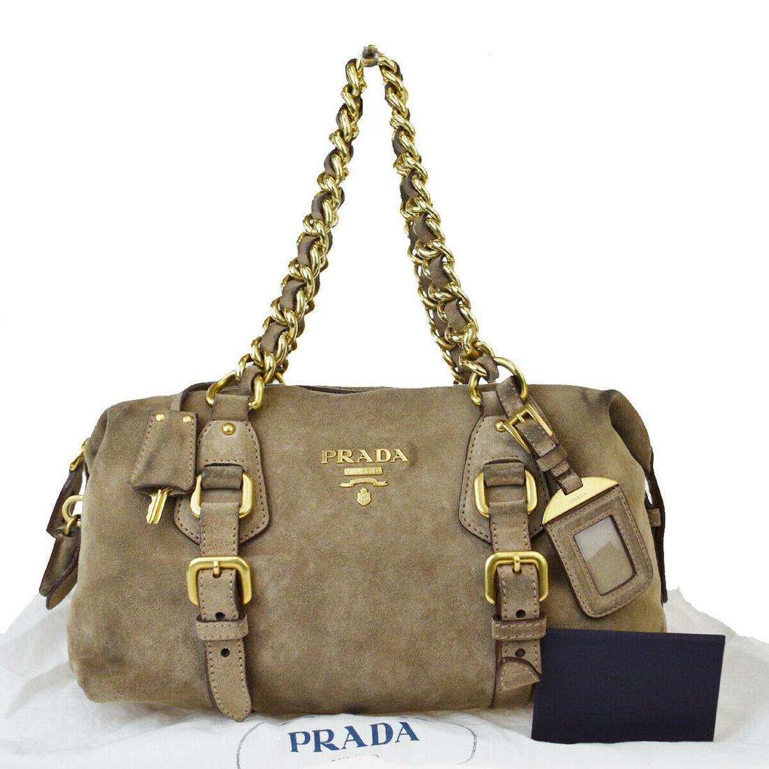 Authentic PRADA Leather, Suede Hand Bag: Brand: PRADA Material: Leather, Suede Style: Hand Bag Color: Beige Size(inch): W 11.4 x H 6.3 x D 5.1 "(approx.) Country of Origin: Italy Come with: Name tag,Dust bag,Authenticity Card All Bidhaus ite