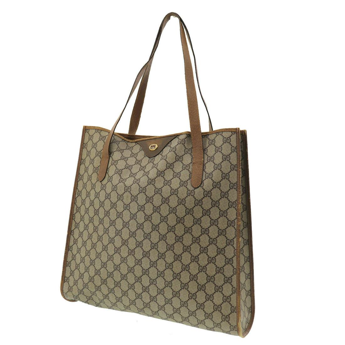 Authentic GUCCI GG Plus Tote Hand Bag: Brand: GUCCI Material: PVC Leather Style: Tote Color: Brown Country of Origin: Italy Come with: - All Bidhaus items come with a 100% money-back authenticity guarantee. Please refer to images carefully