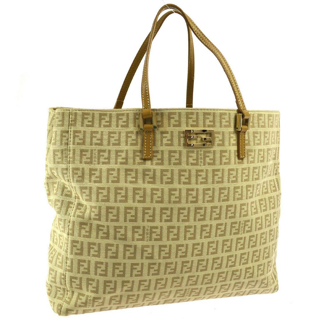 Authentic FENDI Zucchino Hand Tote: Brand: FENDI Material: Canvas, Leather Style: Tote Color: Beige Size(inch): W11.8 x H9.8 x D3.5 " / Strap Drop: 5.5 Country of Origin: Italy Come with: - All Bidhaus items come with a 100% money-back
