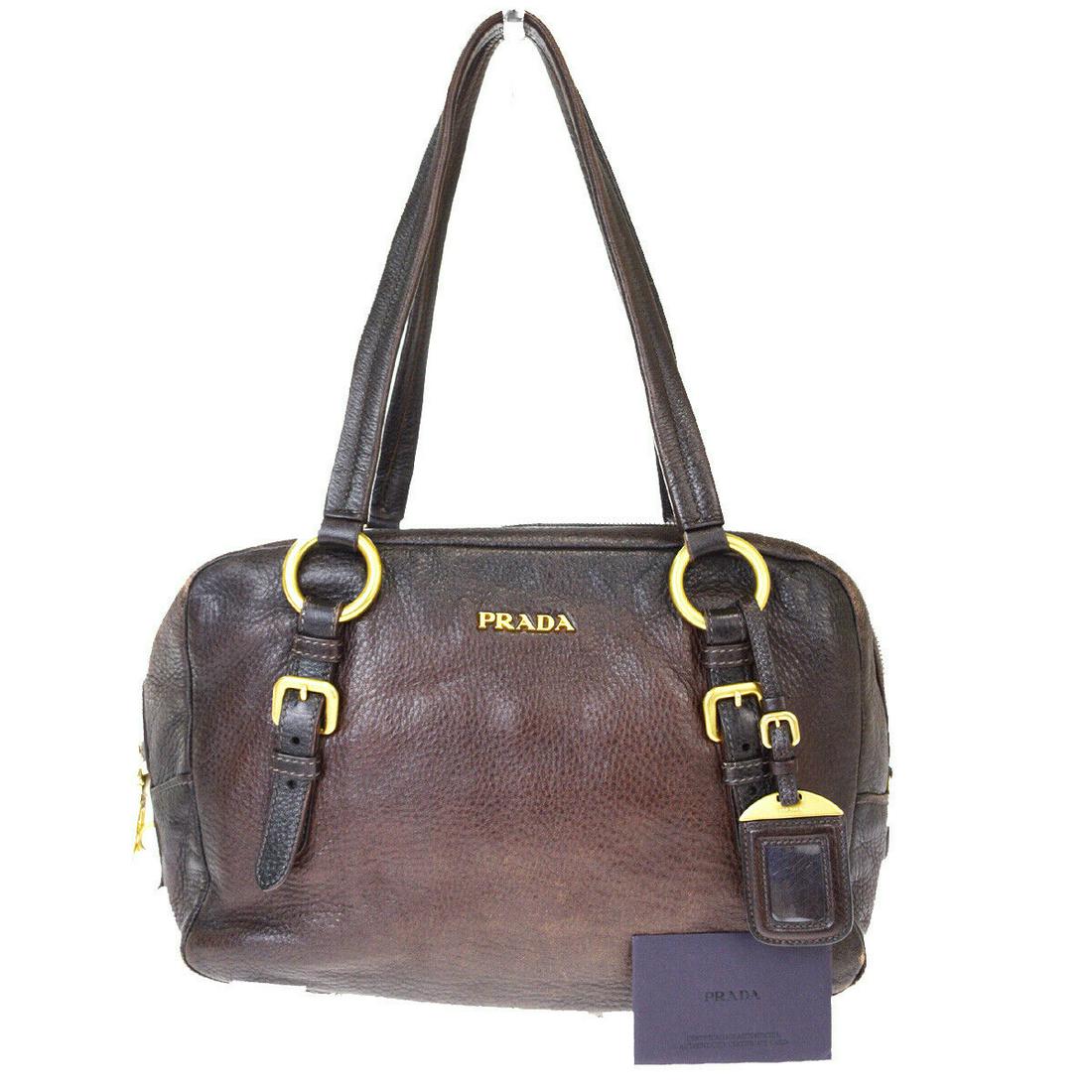 Authentic PRADA Leather Shoulder Bag: Brand: PRADA Material: Leather Style: Shoulder Bag Color: Brown Size(inch): W 12.2 x H 8.3 x D 5.5 "(approx.) Country of Origin: italy Come with: Name tag,Authenticity Card All Bidhaus items come with