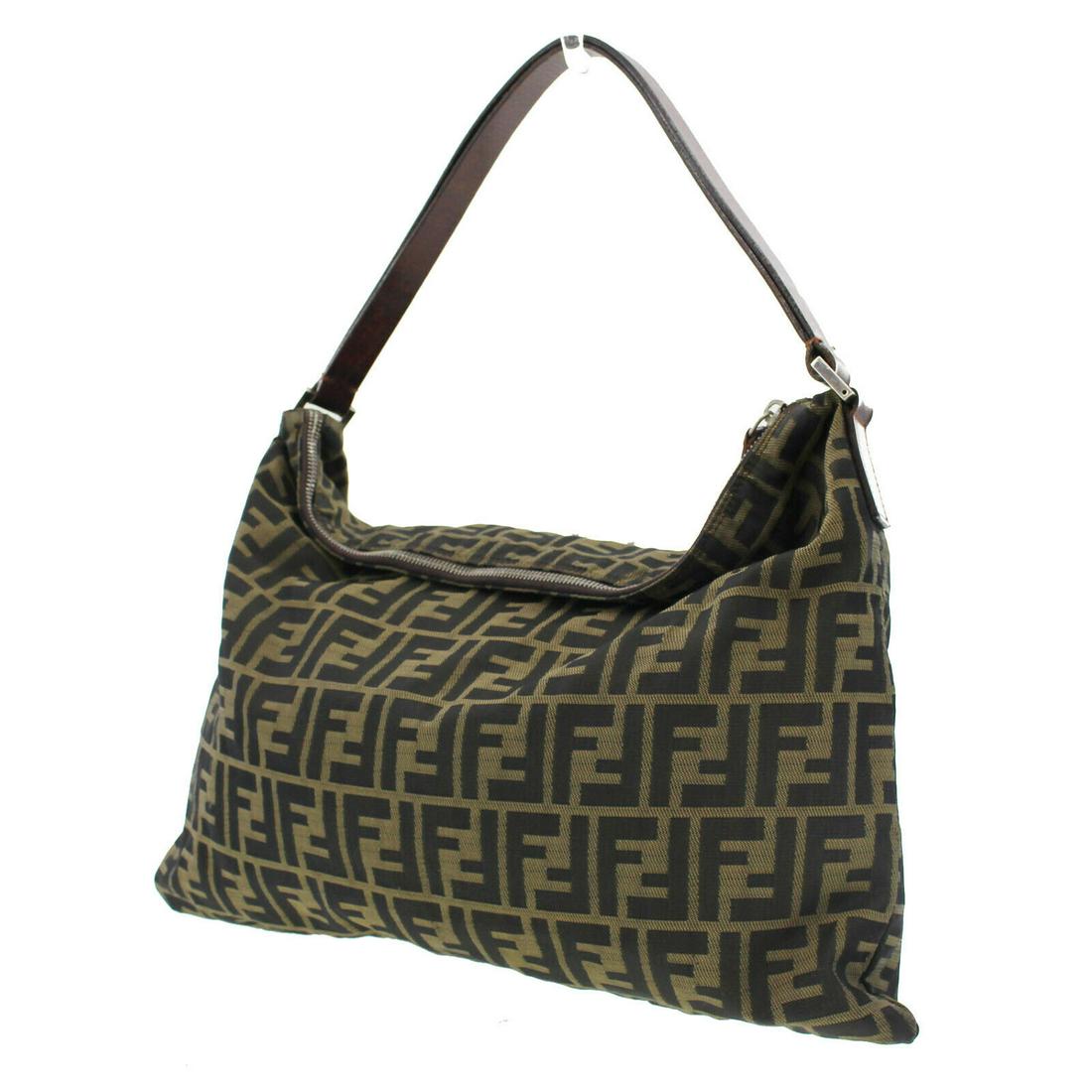 Authentic FENDI Zucca Pattern Hand Bag: Brand: Fendi Material: Canvas Style: Hand Bag Color: Brown Black Size(Inch): H 12.2 x D 0.3 x L 16.5 Handle:18.5 Country of Origin: Italy Come with: - All Bidhaus items come with a 100% money-back aut