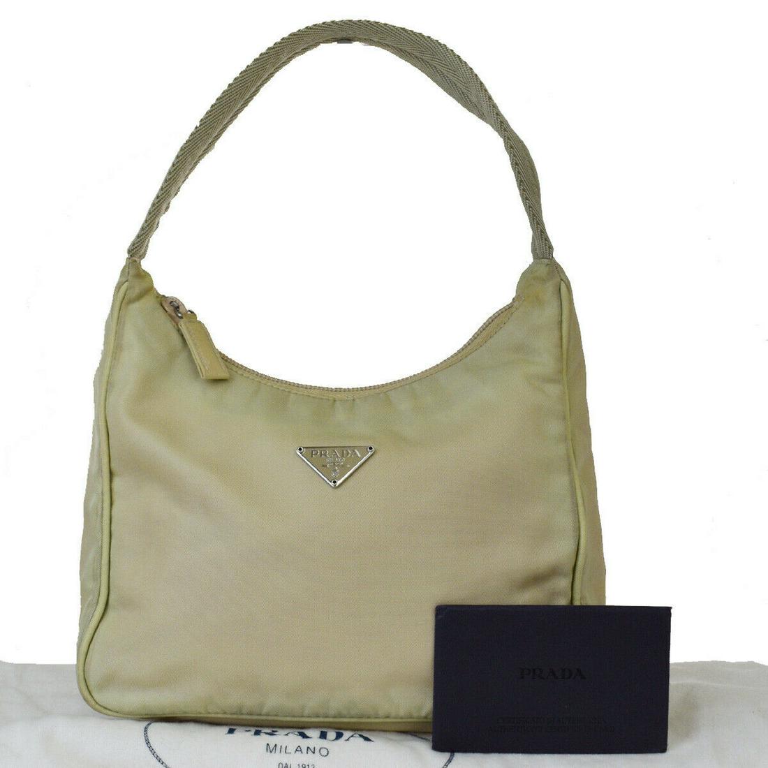 Authentic PRADA Nylon Hand Bag: Brand: PRADA Material: Nylon Style: Hand Bag Color: Ivory Size(inch): W 7.9 x H 5.5 x D 2.8 "(approx.) Country of Origin: Italy Come with: Dust bag,Authenticity Card All Bidhaus items come with a 100%