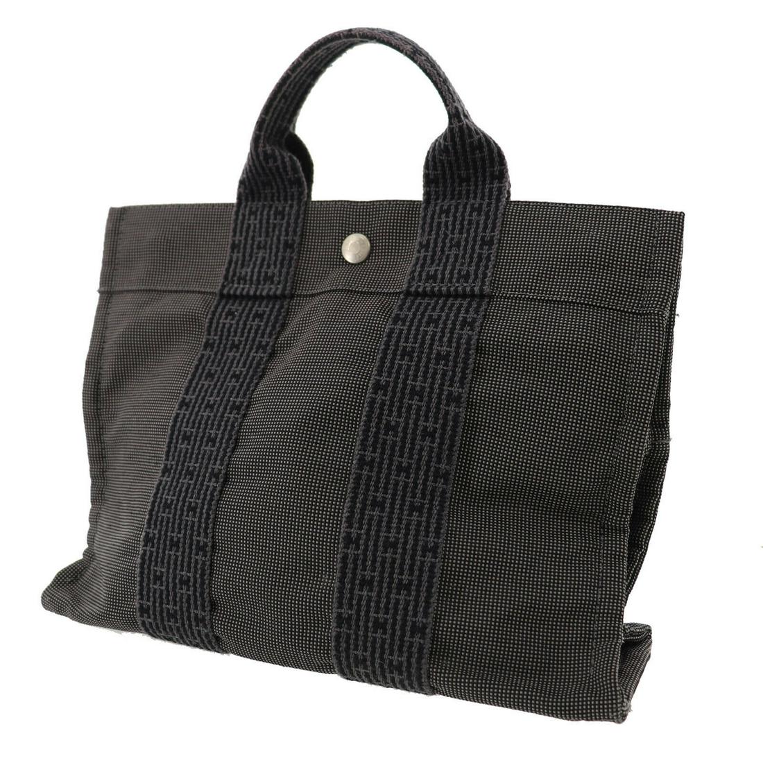 Authentic HERMES Ale Line PM Hand Tote: Brand: HERMÃˆS Material: Nylon Canvas Style: Tote Color: Black Size(Inch): H 9.0 x D 3.1 x L 11.8 Handle 9.0 Country of Origin: France Come with: All Bidhaus items come with a 100% money-back authen