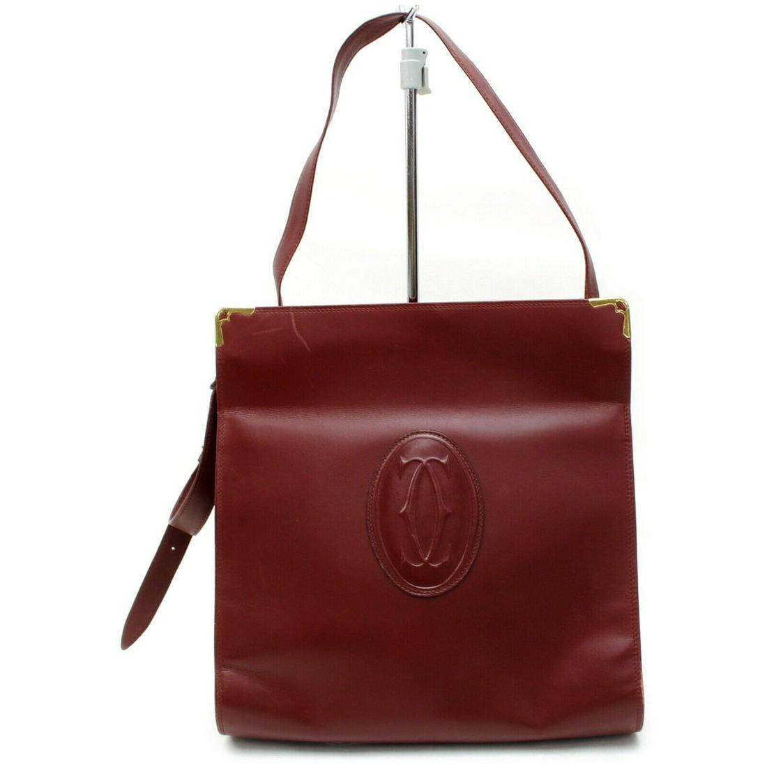 Authentic CARTIER Leather Shoulder Bag: Brand: CARTIER Material: Leather Style: Shoulder Bag Color: Bordeaux Size(inch): W9.84 inch(approx) /25 cm(approx) x H10.2 inch(approx) /26 cm(approx) x D2.36 inch(approx) /6 cm(approx) " / Strap Drop