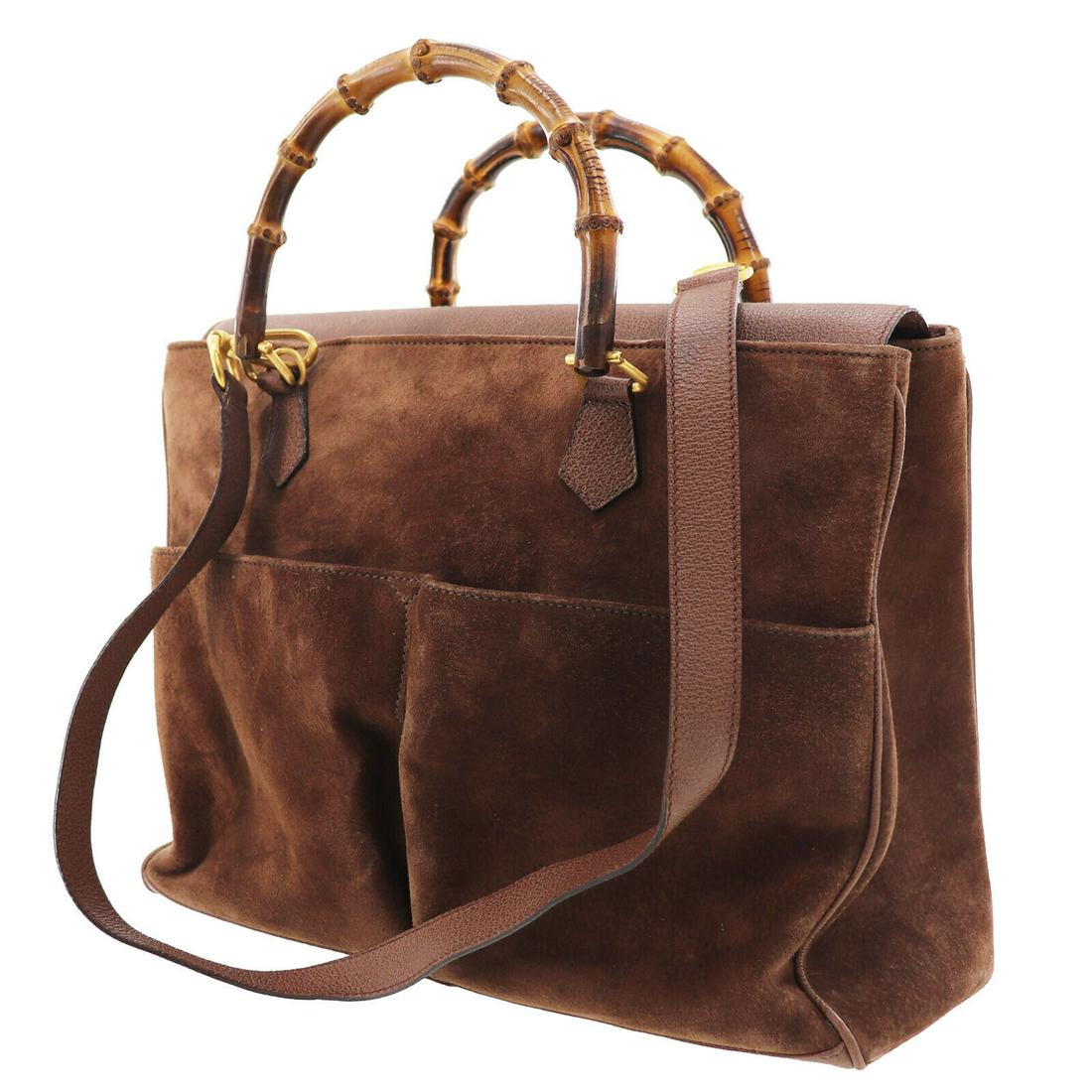 Authentic GUCCI Bamboo Shoulder Hand Bag Brown Suede: Brand: Gucci Material: Suede Leather Style: Hand Bag Color: Brown Size(Inch): H 11.4 x D 6.1 x L 14.5 Handle. 15.3 Shoulder. 36.8 Country of Origin: Italy Come with: - All Bidhaus items come with a 10