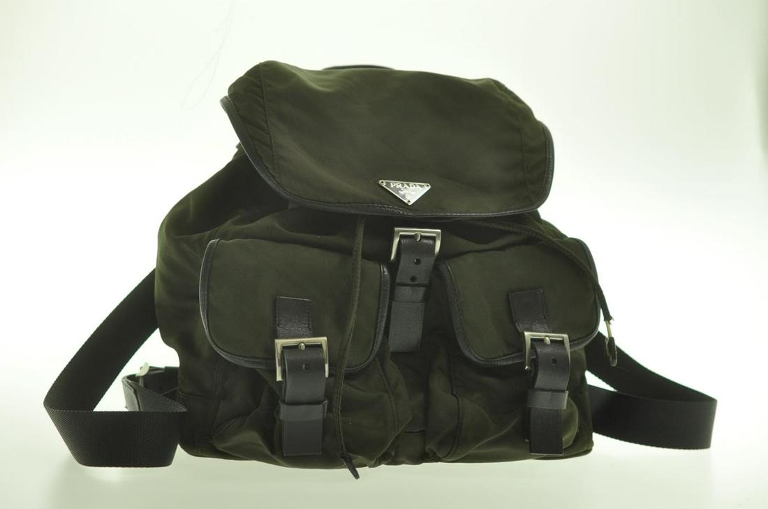 Authentic Prada Nylon Backpack: Brand: Prada Style: Backpack / Knapsack Material: Nylon Color: Khaki Size (Inches): W11.81 X H9.84 X D5.11/ Shoulder Drop 12.59"(Approx) Exterior Condition: Nylon : Minor Rubbing, Signs Of Aging, Loos