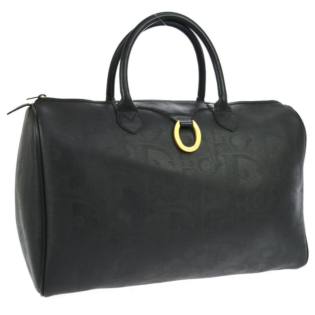 Authentic CHRISTIAN DIOR Logos Travel Hand Bag: Brand: CHRISTIAN DIOR Material: PVC, Leather Style: Travel Hand Bag Color: Black Size(inch): W16.9 x H11.0 x D8.7 " Country of Origin: France Come with: - All Bidhaus items come with a 100% money-back
