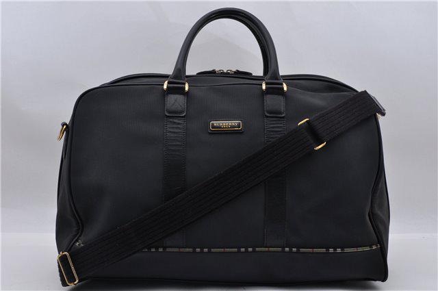 Authentic BURBERRY Travel Boston Bag Nylon Leather: Brand: BURBERRYS Material: Nylon Style: Boston Bag Color: Black Size(inch): W17.7 x H11.4 x D9.1" / Handle Drop 5.1"(Approx) Country of Origin: - Accessory: Shoulder Strap All Bidhaus items come with 