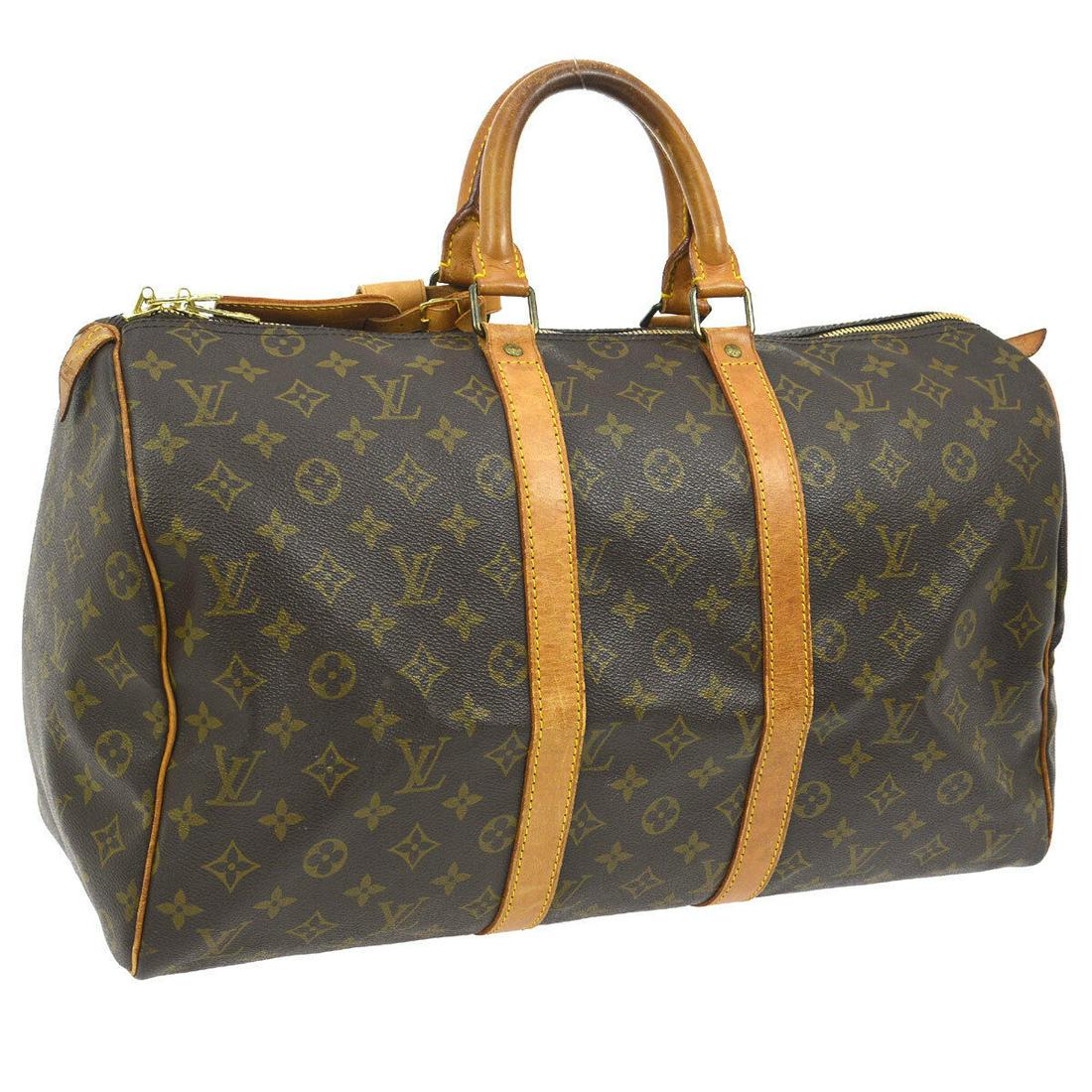 Authentic LOUIS VUITTON KEEPALL 45 MONOGRAM: Brand: LOUIS VUITTON Material: Monogram Canvas, Leather Style: Travel Hand Bag Color: Brown Size(inch): W18.1 x H10.2 x D8.1 " / Strap Drop: 4.3 Country of Origin: France Come with: Handle Holder, Nam