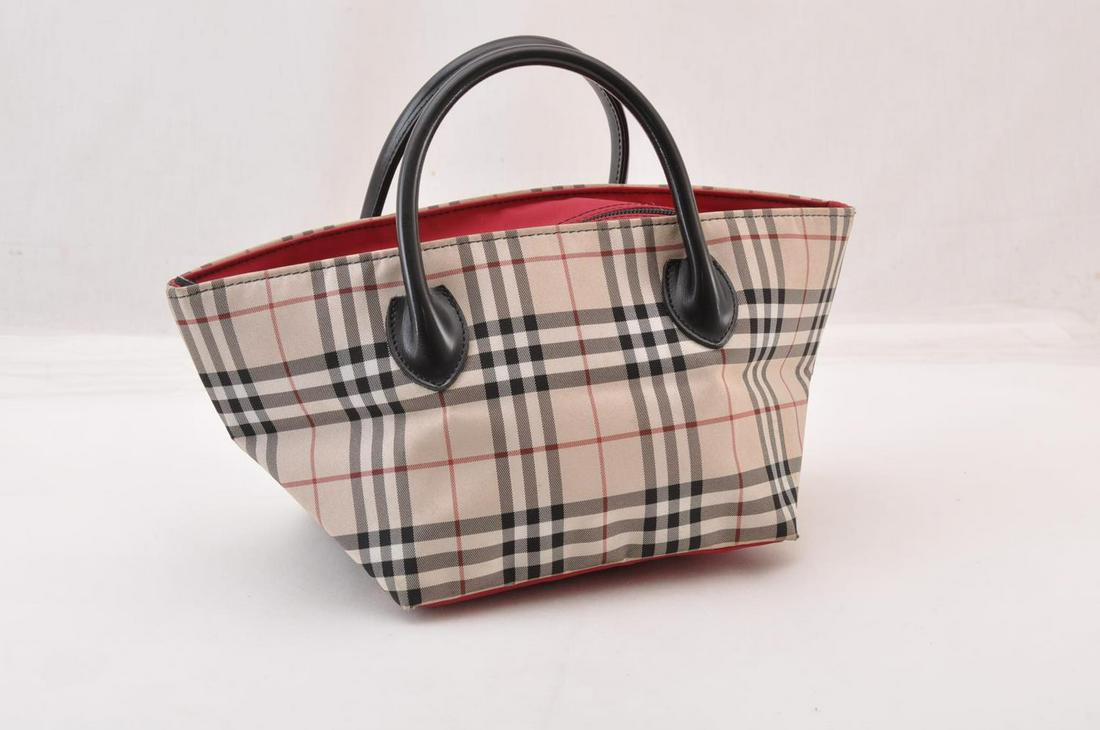 Authentic Burberry Blue Label Nylon Hand Bag: Brand: Burberry Style: Hand Bag Material: Nylon Color: Beige Size (Inches): W6.69 X H4.72 X D6.29Inch(Approx) Exterior Condition: Nylon : Sun Burn, Signs of Use, Minor Rubbing, Loose ShapeLeather : Mi