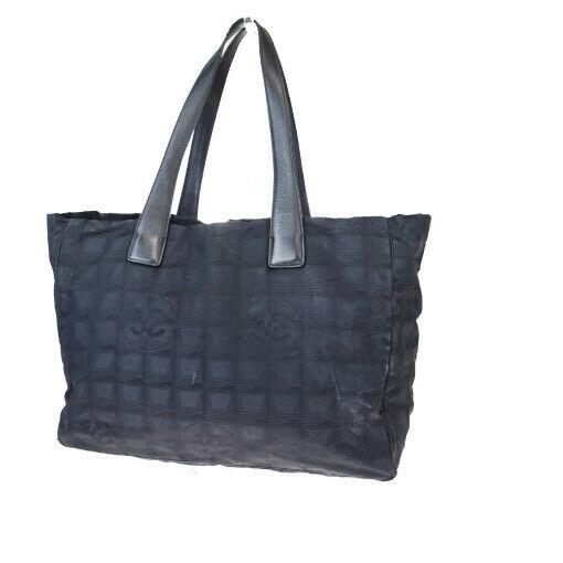 Authentic CHANEL Jacquard, Leather Tote bag: Brand: CHANEL Material: Jacquard, Leather Style: Tote bag Color: Black Size (HxWxD): 27cm x 34cm x 14cm / 10.62'' x 13.38'' x 5.51'' Country of Origin: Italy All Bidhaus items come with a 100% money-b