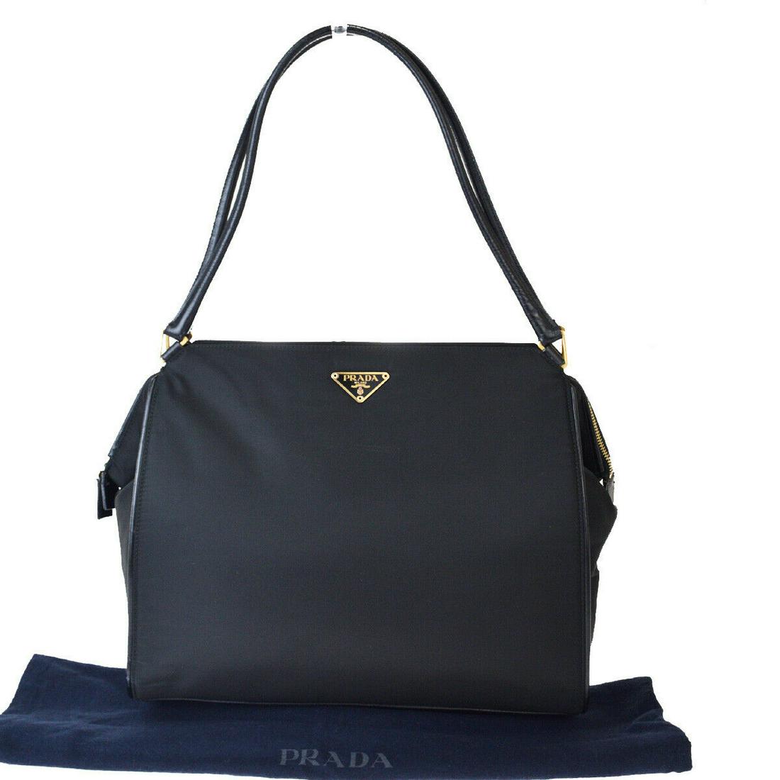 Authentic PRADA Nylon, Leather Shoulder Bag: Brand: PRADA Material: Nylon, Leather Style: Shoulder Bag Color: Black Size(inch): W 11.8 x H 10.2 x D 3.1 "(approx.) Country of Origin: Italy Come with: Dust bag All Bidhaus items come with a 100% mo