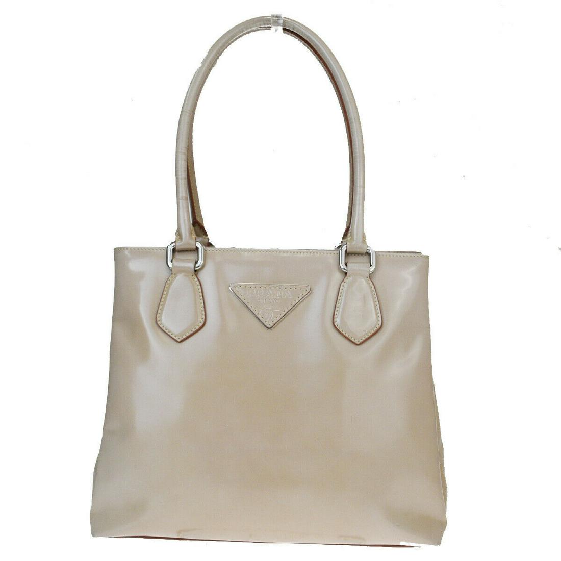 Authentic PRADA Leather Shoulder Bag: Brand: PRADA Material: Leather Style: Shoulder Bag Color: Beige Size(inch): W 10.6 x H 9.1 x D 3.9 "(approx.) Country of Origin: Italy Come with: - All Bidhaus items come with a 100% money-back authen