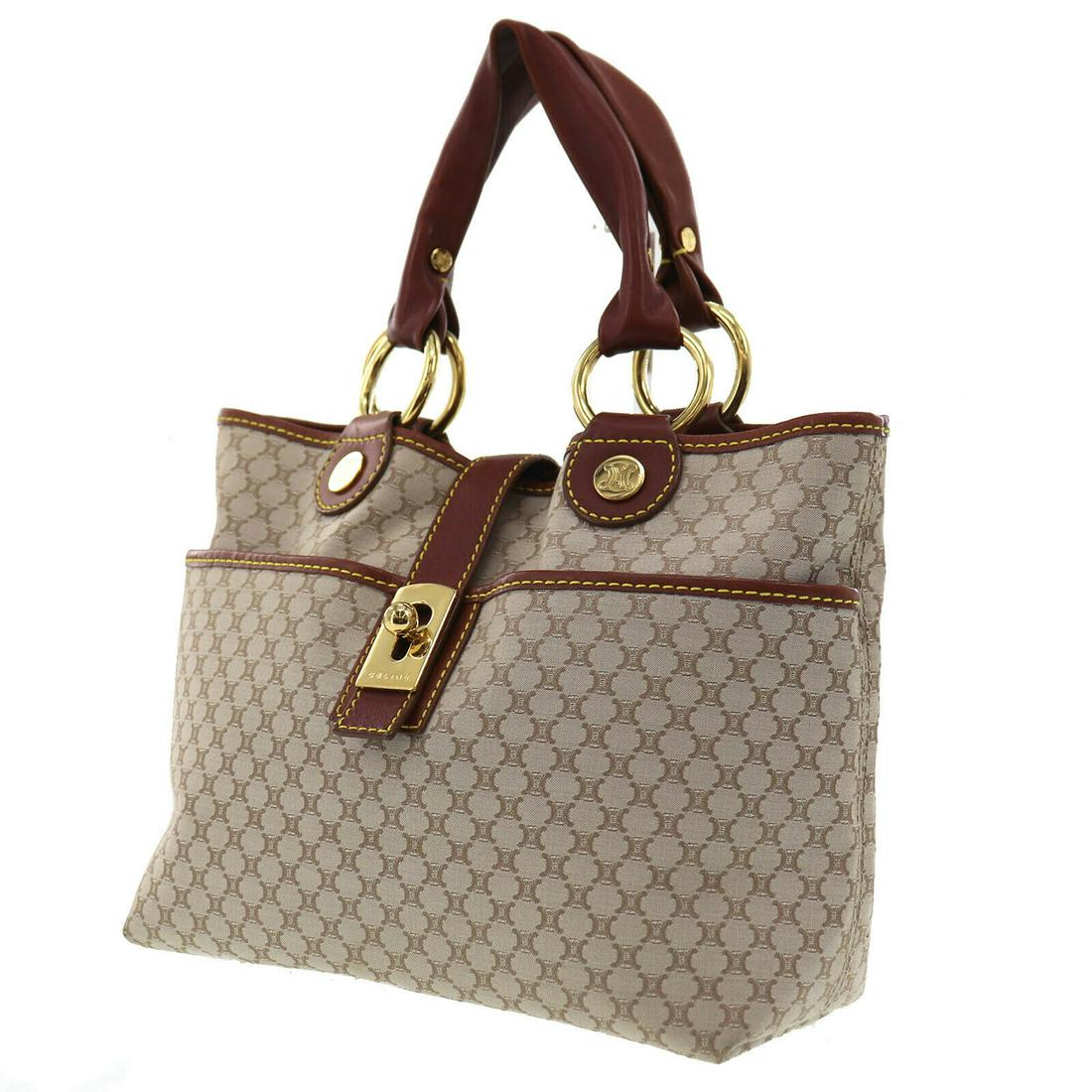 Authentic CELINE Macadam Pattern Hand Bag: Brand: CELINE Material: Canvas Leather Style: Hand Bag Color: Beige Brown Size(Inch): H 8.2 x D 4.5 x L 9.8 Handle : 13.7 All Bidhaus items come with a 100% money-back authenticity guarantee. Please r