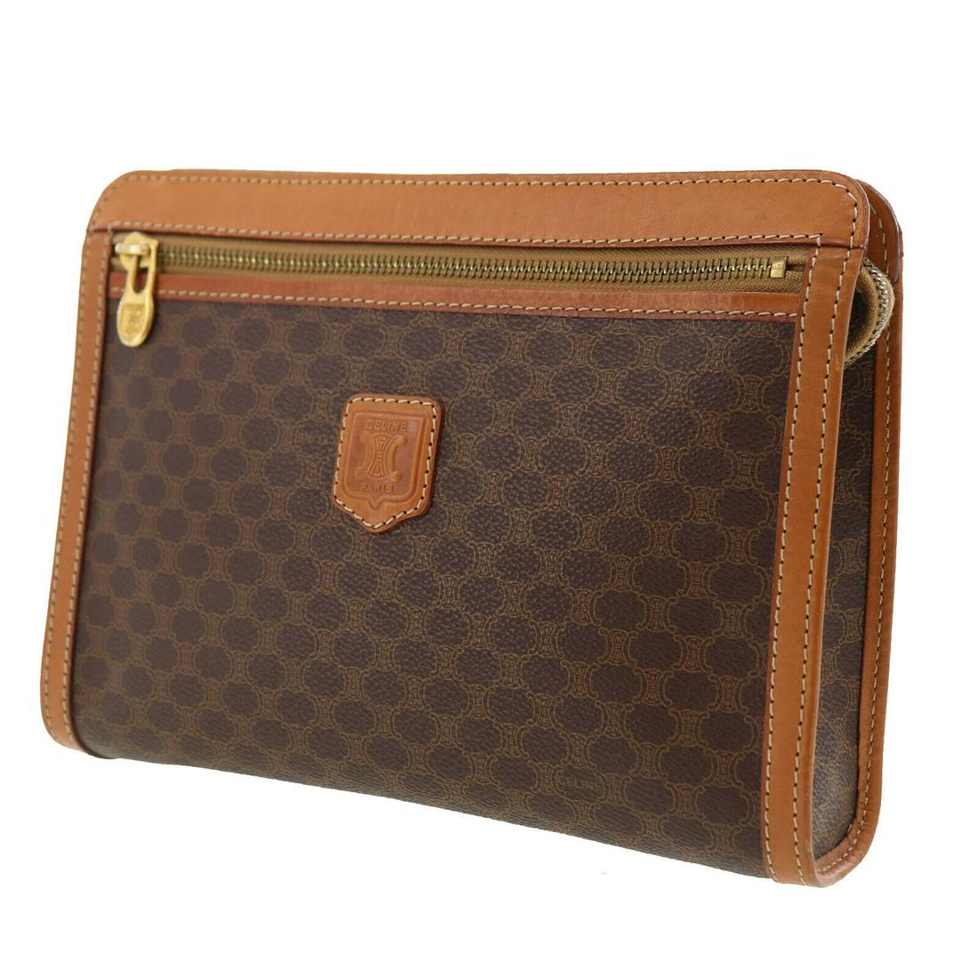 Authentic CELINE Macadam Pattern Clutch: Brand: CELINE Material: Macadam PVC Canvas Style: Clutch Bag Color: Brown Size(Inch): H 7.2 x D 2.3 x L 9.8 Country of Origin: Italy Come with: - All Bidhaus items come with a 100% money-back authenti