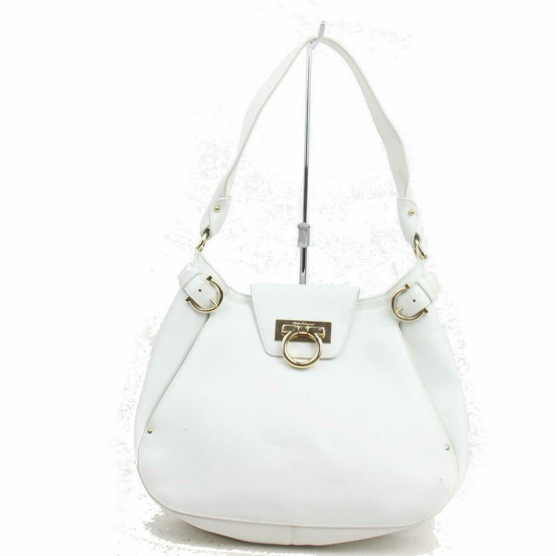 Authentic FERRAGAMO Leather Shoulder Bag: Brand: FERRAGAMOMaterial: LeatherStyle: Shoulder BagColor: WhitesSize(inch): W11.8 inch(approx) /30 cm(approx) x H8.66 inch(approx) /22 cm(approx) x D2.75 inch(approx) /7 cm(approx) "Country of Origin