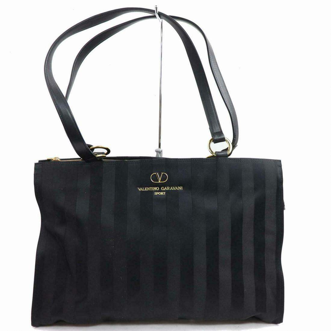 Authentic VALENTINO GARAVANI Nylon Tote Bag: Brand: VALENTINO GARAVANIMaterial: NylonStyle: Tote BagColor: BlackAll Bidhaus items come with a 100% money-back authenticity guarantee. Please refer to images carefully for condition details. Unless 