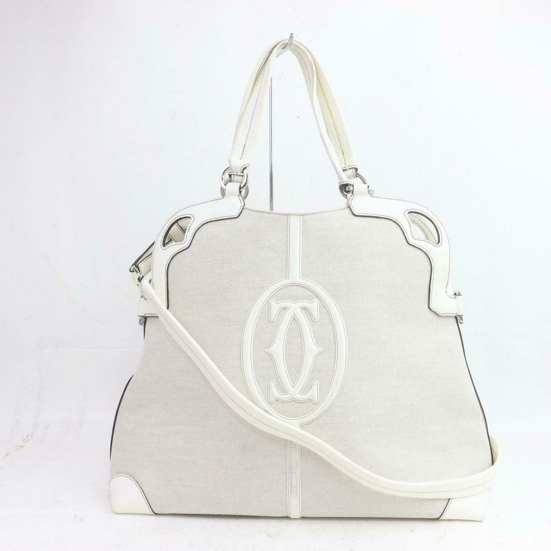 Authentic CARTIER Canvas Hand Bag: Brand: CARTIERMaterial: CanvasStyle: Hand BagColor: CreamSize(inch): W15.7 inch(approx) /40 cm(approx) x H12.5 inch(approx) /32 cm(approx) x D5.11 inch(approx) /13 cm(approx) " / Strap Drop: Shoulder 
