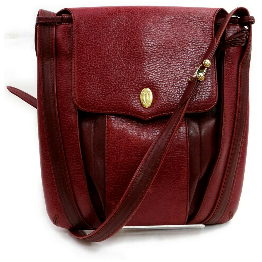 Authentic CARTIER Leather Shoulder Bag: Brand: CARTIERMaterial: LeatherStyle: Shoulder BagColor: BordeauxSize(inch): W9.84 inch(approx) /25 cm(approx) x H10.2 inch(approx) /26 cm(approx) x D0.39 inch(approx) /1 cm(approx) " / Strap Drop: Sh
