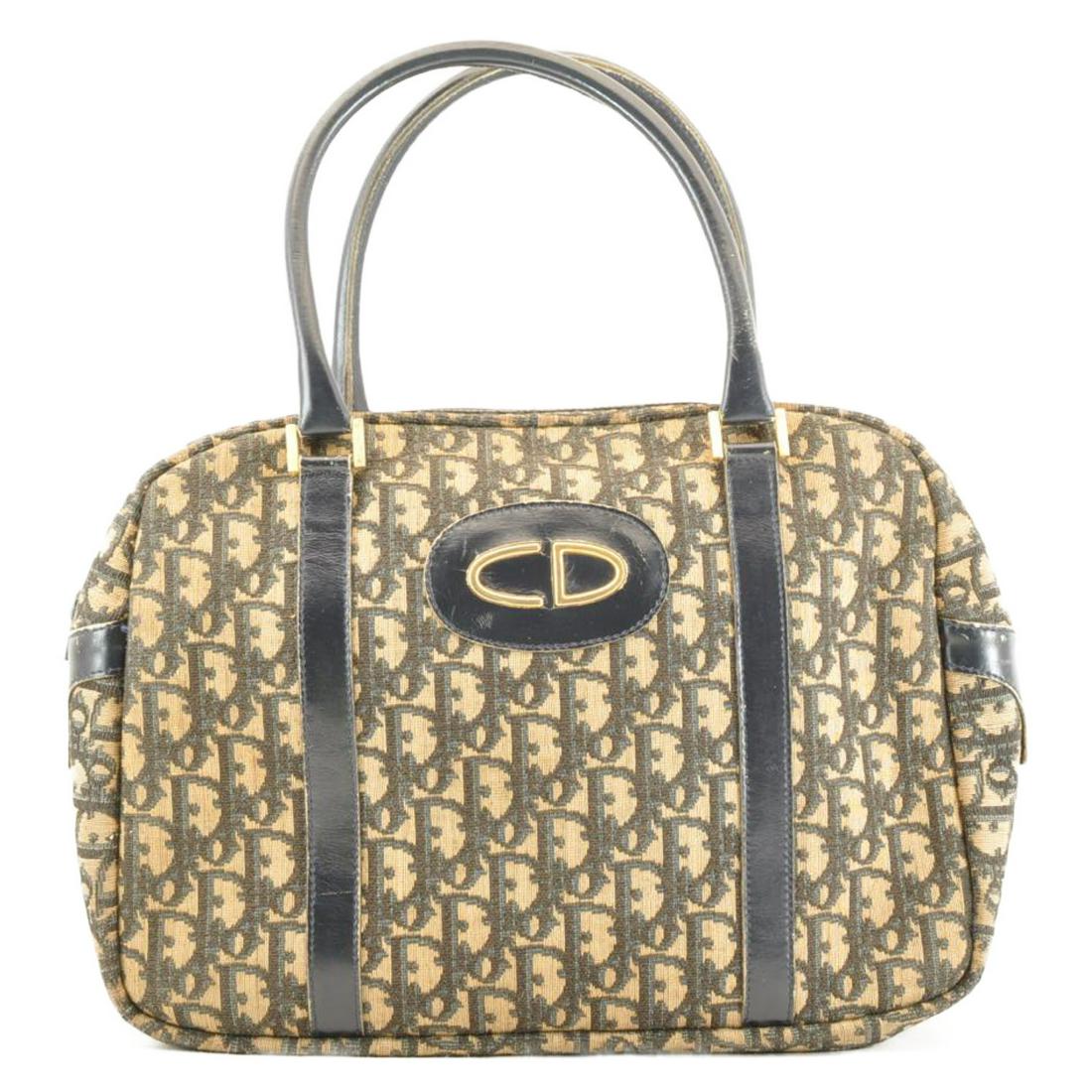 Authentic CHRISTIAN DIOR Trotter Canvas Hand Bag: Brand: CHRISTIAN DIOR Material: Canvas Style: Hand Bag Color: Blue Size(inch): W15.35 x H8.66 x D4.92inch(Approx) Country of Origin: Spain Accessory: There is no item box and dust bag. We will send on