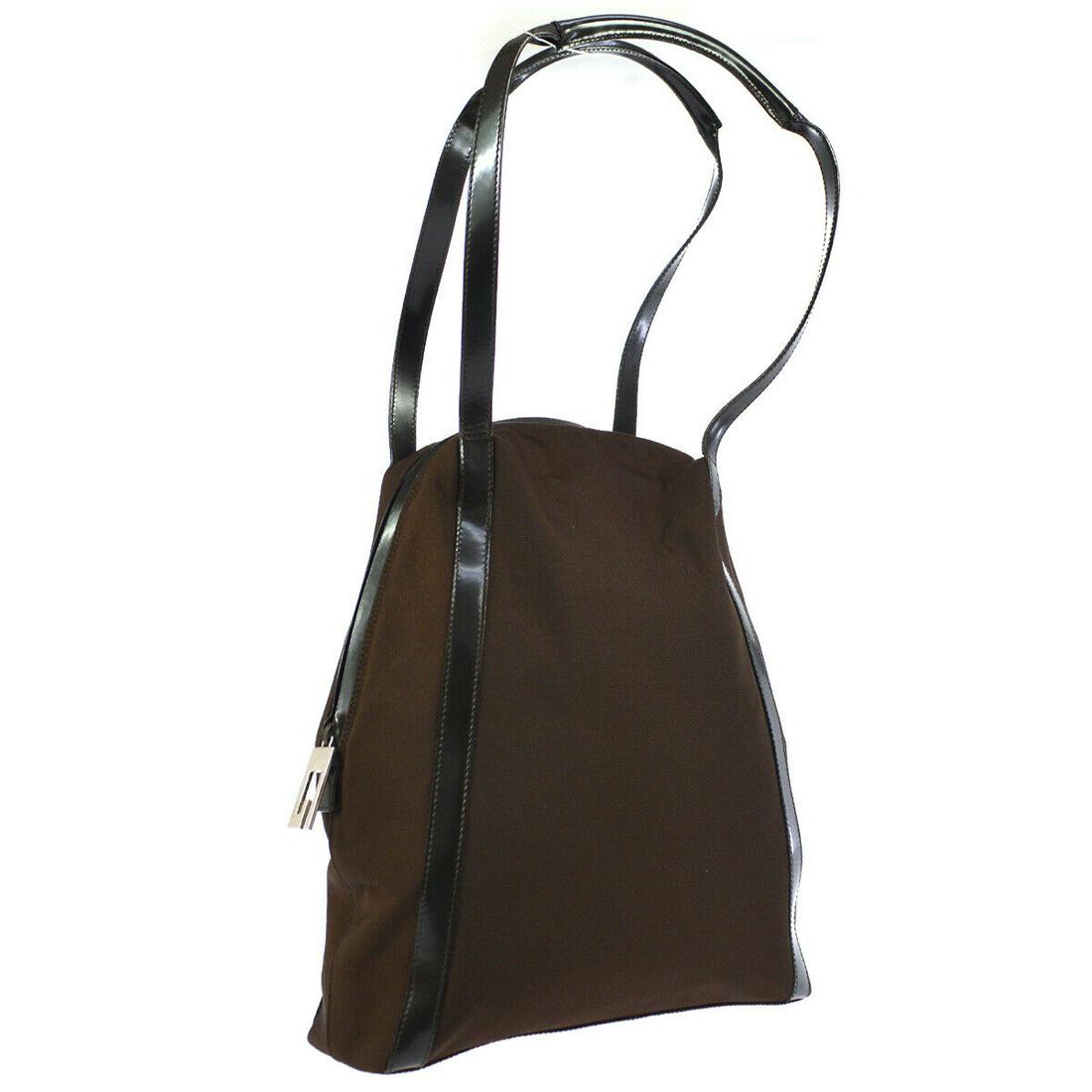 Authentic GUCCI Shoulder Tote Bag: Brand: Gucci Material: Leather, Nylon Style: Tote Color: Brown Size(inch): W11.0 x H13.8 x D3.1 " / Strap Drop: 8.7 Size(inch): W 11.0 x H 13.8 x D 3.1 " Strap Drop. 8.7 " Country of Origin: Italy Com