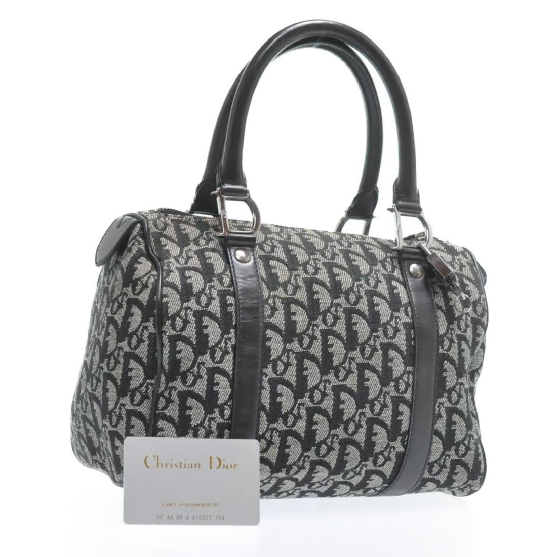 Authentic Christian Dior Trotter Canvas Hand Bag: Brand: Christian Dior Style: Hand Bag Material: Canvas Color: Navy Made In: France Size (Inches): W9.84 X H7.08 X D6.29Inch(Approx) Exterior Condition: Canvas : minor loose Shape, Rubbing Leather : Wi