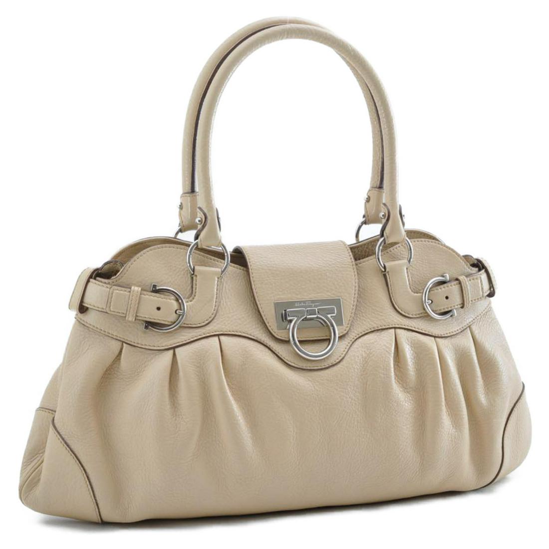 Authentic SALVATORE FERRAGAMO Gancini Hand Bag: Brand: SALVATORE FERRAGAMO Material: Leather Style: Hand Bag Color: Beige Size(inch): W18.11 x H10.62 x D2.75inch(Approx) Country of Origin: Italy Accessory: There is no item box and dust bag. We will