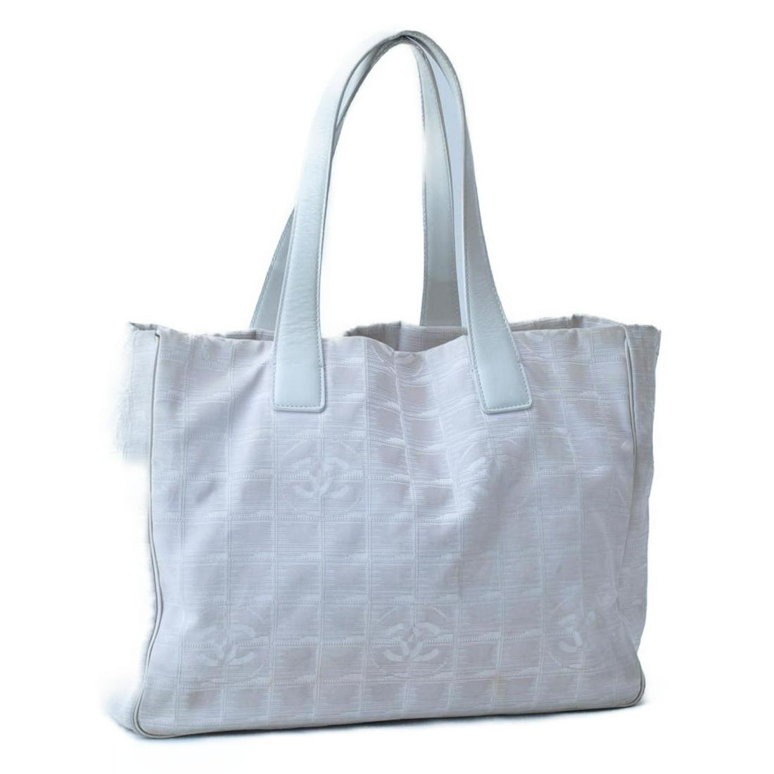 Authentic CHANEL Travel Line Nylon Tote Bag: Brand: CHANEL Material: Nylon Style: Tote Bag Color: Beige Size(inch): W12.59 x H9.84 x D5.51inch(Approx) Country of Origin: France Accessory: There is no item box and dust bag. We will send only the 