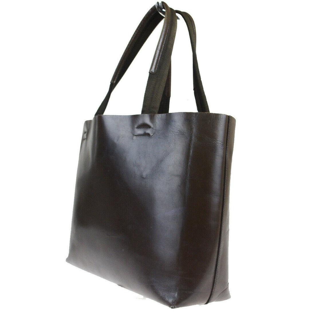 Authentic Prada Leather Tote bag: Brand: Prada Material: Leather Style: Tote bag Color: Brown Size (HxWxD): 25cm x 32cm x 10cm / 9.84'' x 12.59'' x 3.93'' Country of Origin: Italy All Bidhaus items come with a 100% money-back authenti